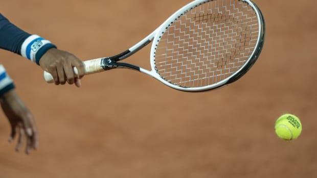 Sep 27, 2020; Paris, France; Cori Gauff (USA) reaches for the ball prior to her serve during her match against Johanna Konta (GBR) on day one at Stade Roland Garros. Mandatory Credit: Susan Mullane-USA TODAY Sports